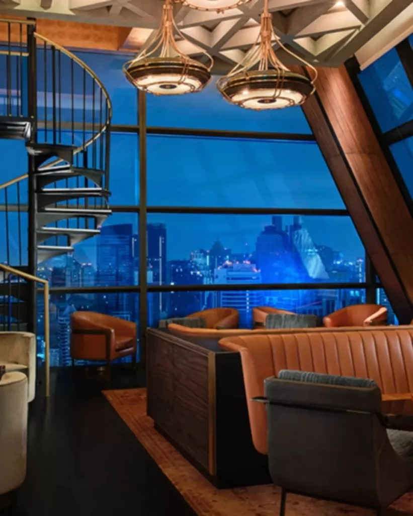 interior of Lennons cocktail bar in Bangkok with the view of Bangkok skyline at night